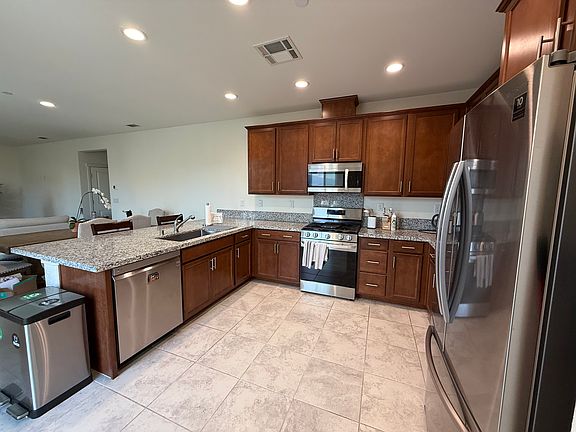 Kitchen includes dishwasher, refrigerator, stove, and microve