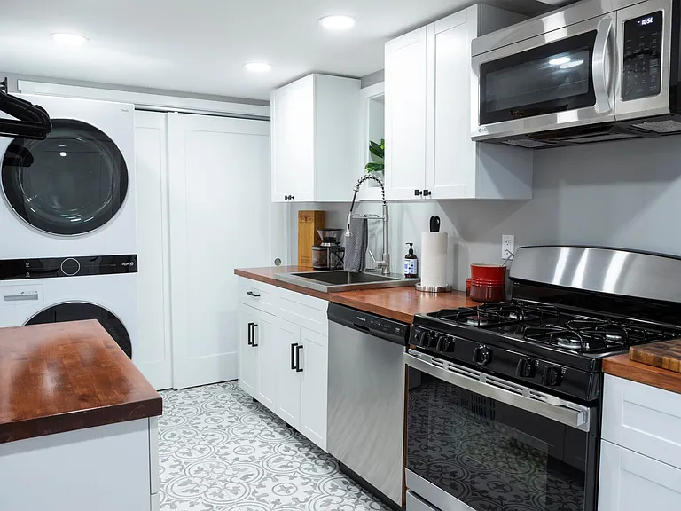 Basement kitchenette and laundry room
