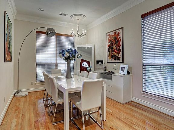 Currently utilized by tenants as a formal dining, this room offers flexibility and can function as an office or a formal living. Complete with crown moulding and brilliant chandelier.