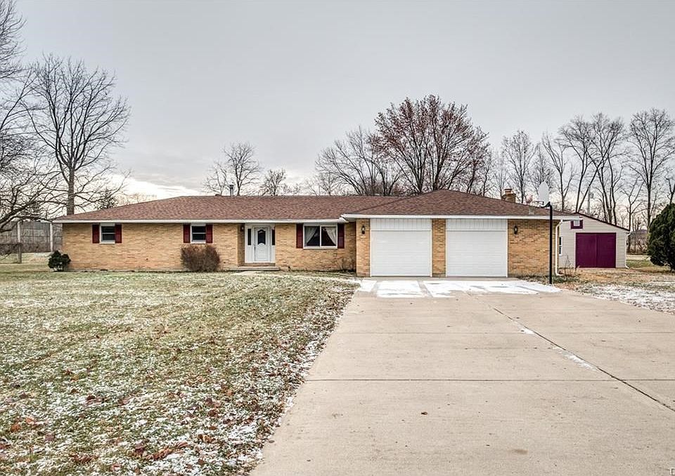 Ranch with 2 1/2 car attached garage and detached heated workshop