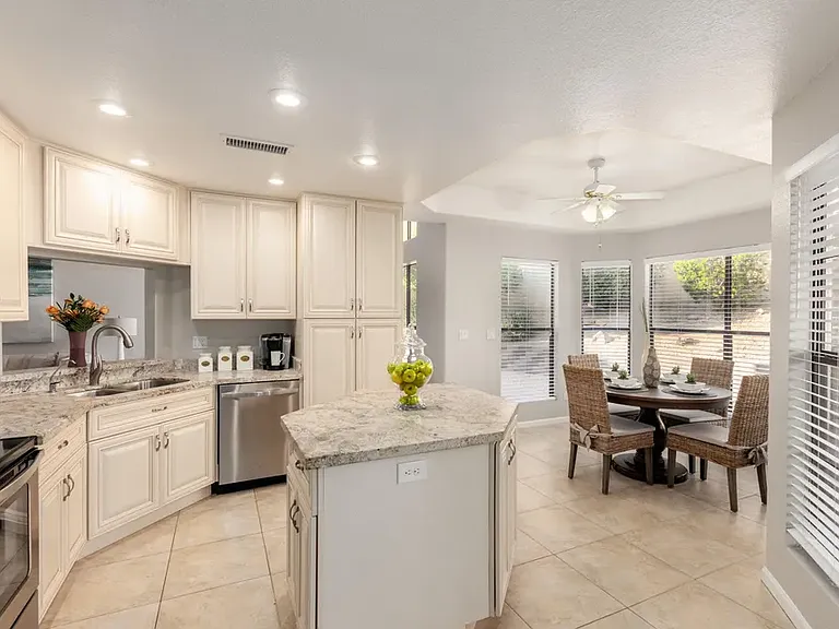 Eat in the kitchen with an island, dishwasher, stove, microwave, new refrigerator with a Sub-Zero drawer and drink center, and a garbage disposal. Lots of natural light!