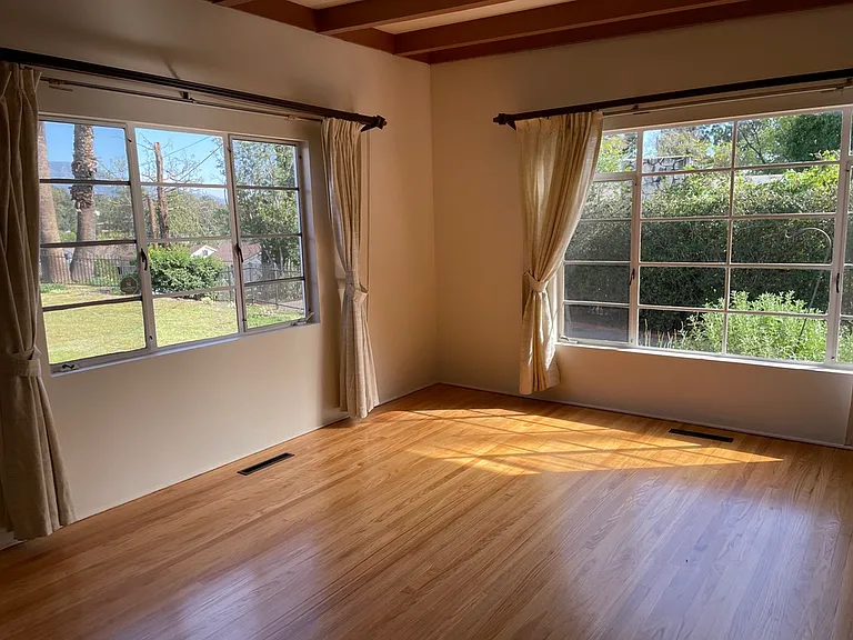 Living room windows looking toward front yard, side driveway