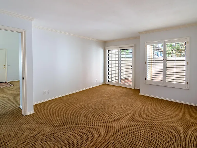Downstairs primary bedroom with private patio