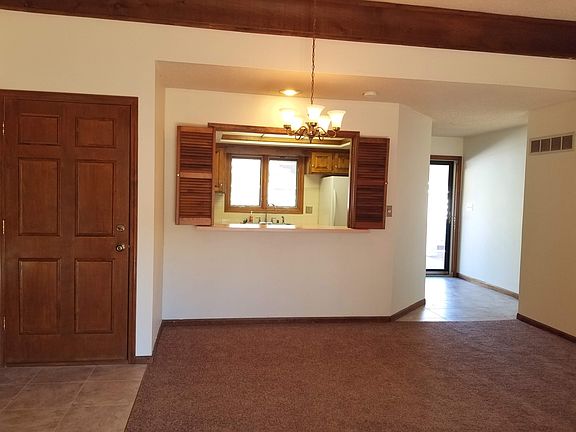 Main Living Room - view of kitchen and front door