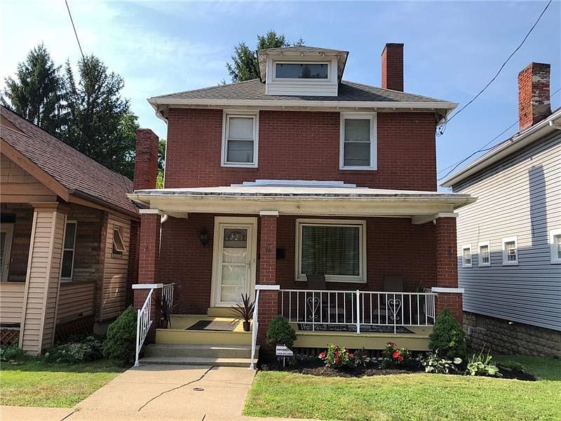 Front. This beautiful, brick, Colonial has wonderful curb appeal and is located minutes from Pittsburgh.