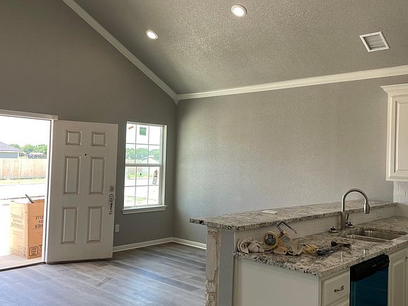 Vaulted ceiling in kitchen and living area