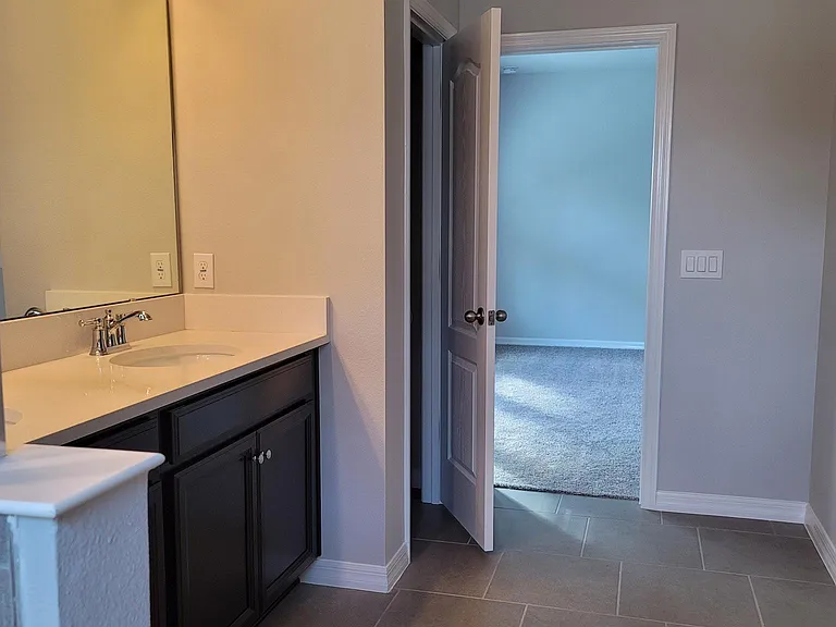 Master bathroom with linen closet