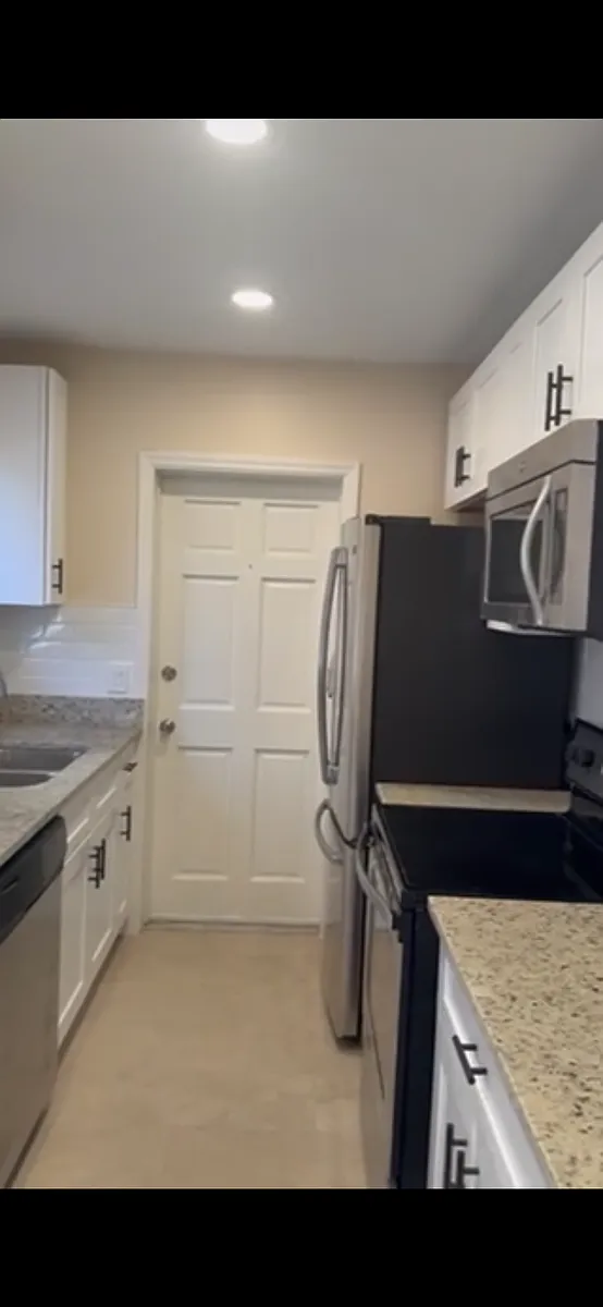 Gorgeous new paint with neutral colors throughout house. Recess lighting in kitchen and LR; new fans in each bedroom. - 1341 31st St