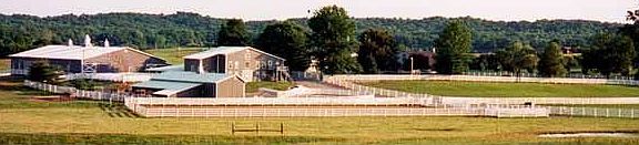 Back view of barns and pasture
