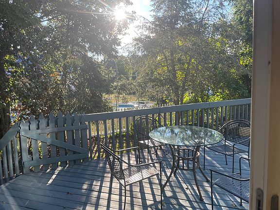 Quiet back yard with large deck, grill and retractable awning
