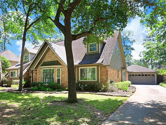 OVERSIZED 2 car detached garage to the rear of home with long driveway able to accommodate multiple cars or a pick up game of basketball.
