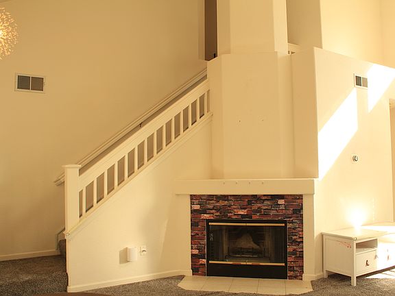fire place and stairs to upstairs