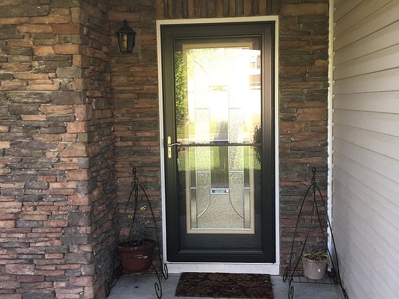 Storm door and glass front door