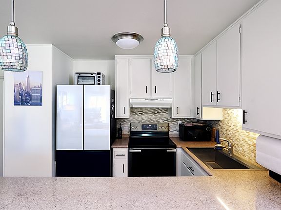 Kitchen with upgraded appliances and all essentials