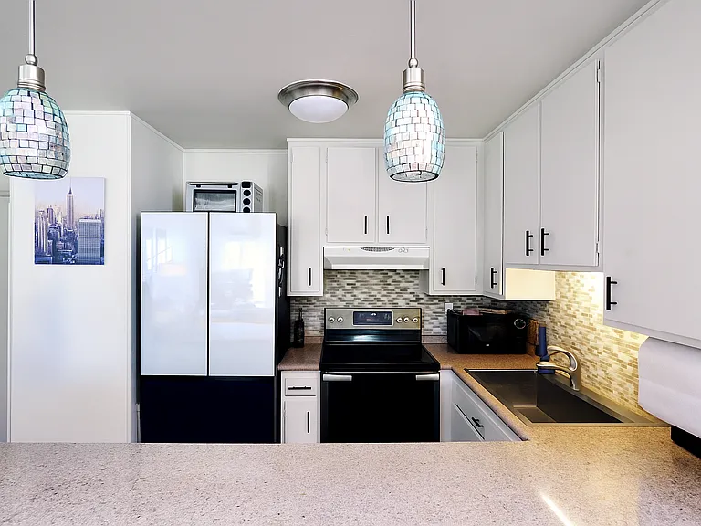 Kitchen with upgraded appliances and all essentials
