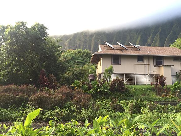 The home is situated on a farm in the back roads of Waimanalo practicing agroforestry. It is located up a private road amongst other ag/country lots