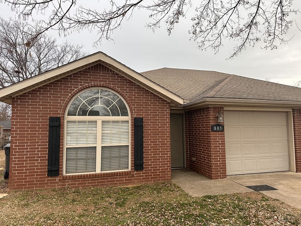 Front of duplex. One car garage and two off road parking spots. Fenced in backyard.