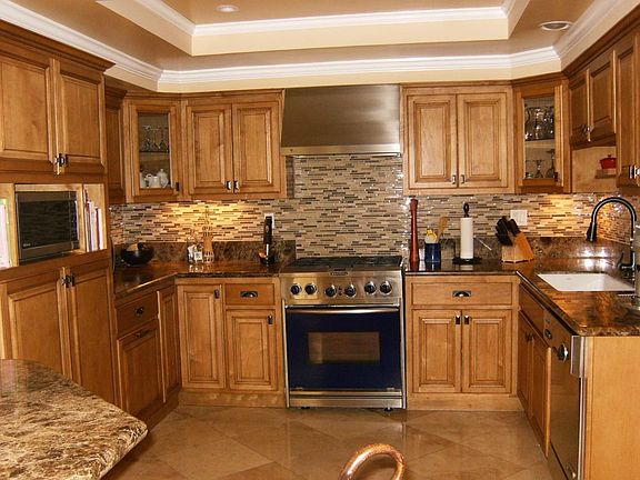 Upgraded marble counter tops, custom cabinets, crown molding