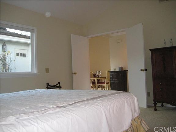 Double door entry into the master suite with a nice size window looking into the atrium.