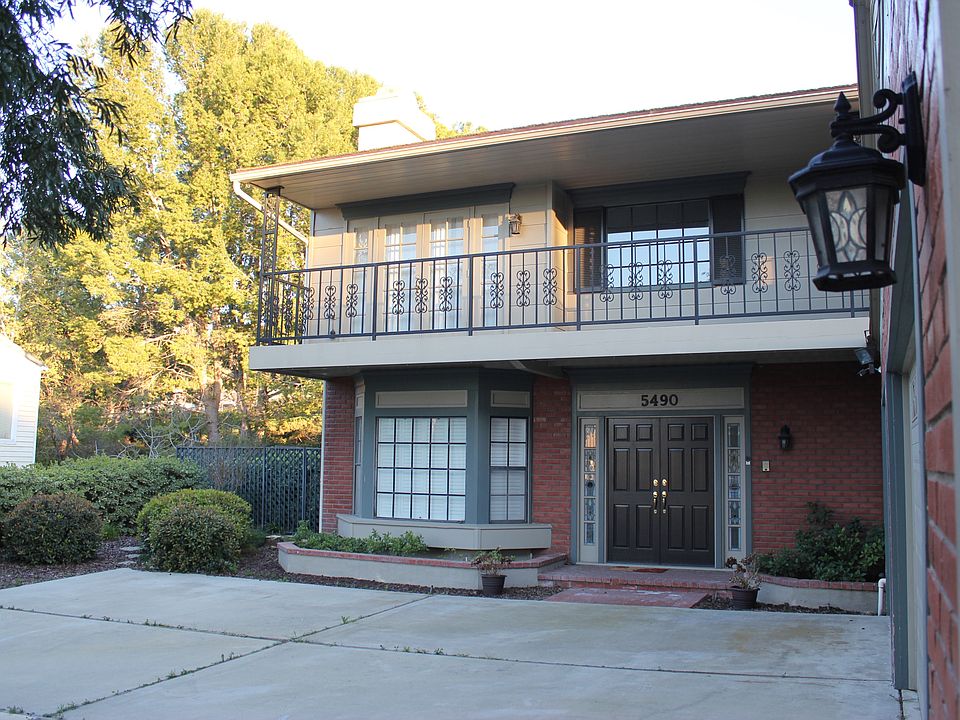 Charming entry with double doors and balcony