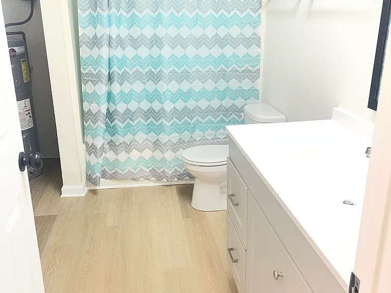 bath room with utility closet and washer dryer hook ups