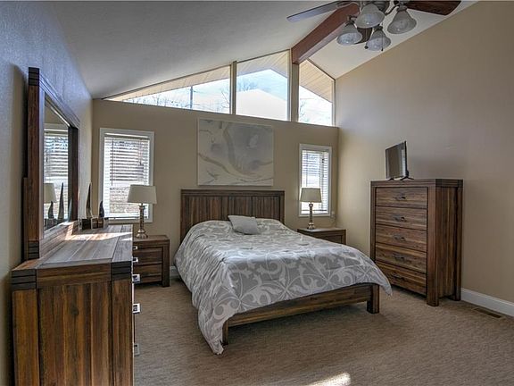 Spacious master bedroom with vaulted ceilings, tons of natural light and a private master bath.