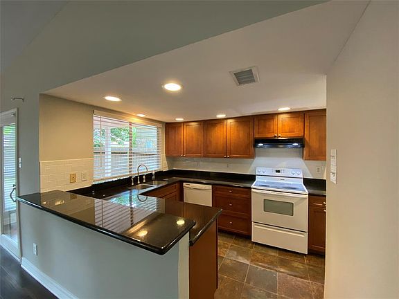 Kitchen updated with custom cabinets, self closing drawers, granite counters!