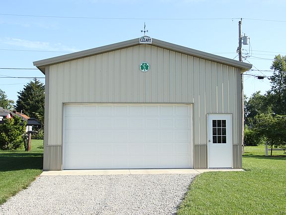 Three-car garage behind home