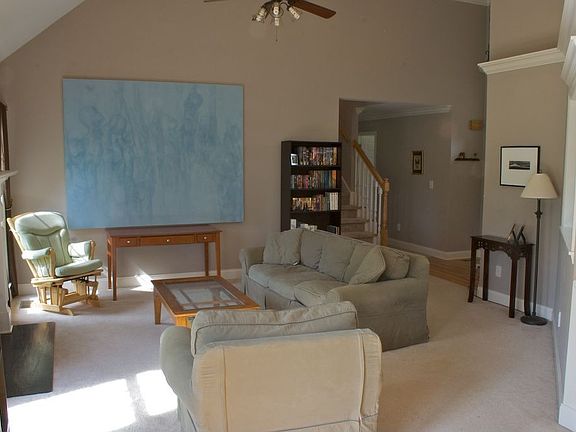 great room, looking towards the entryway and hall leading to bedrooms