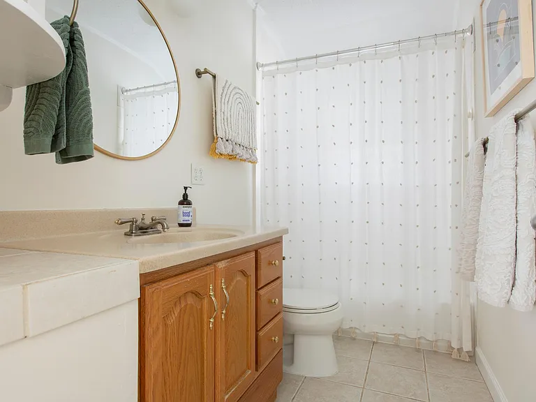 Bathroom with bath and shower.