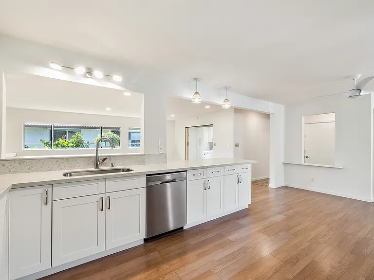 Another shot of kitchen looking towards dining area. To right in kitchen is space for small eat-in table.