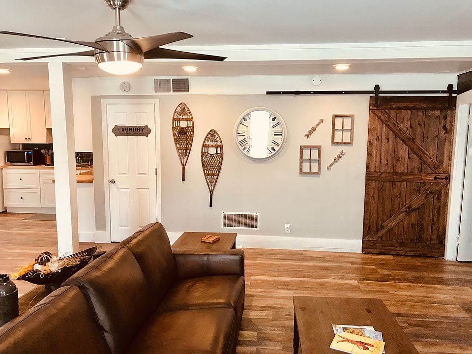 Living Room Pic 2 (Laundry room is located where the white door is, barn style door is to the bathroom)