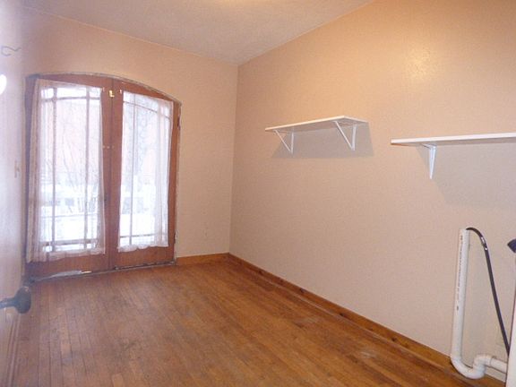 This large room from the back deck entry is set up for use as a laundry room.