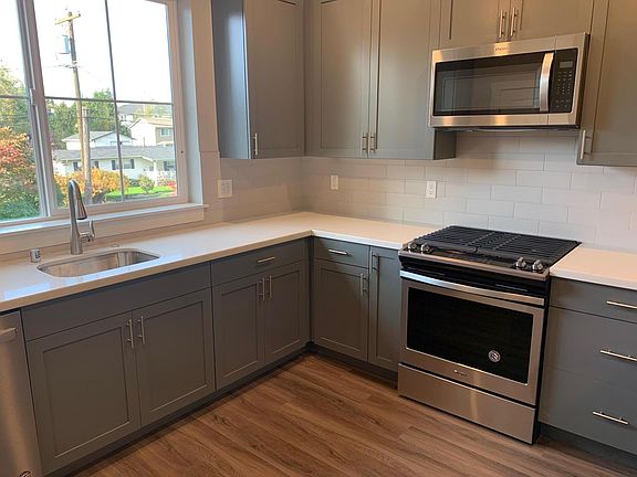 Wonderful Chef's Kitchen features painted cabinets, quartz counters and upgraded Whirlpool appliances, including gas range