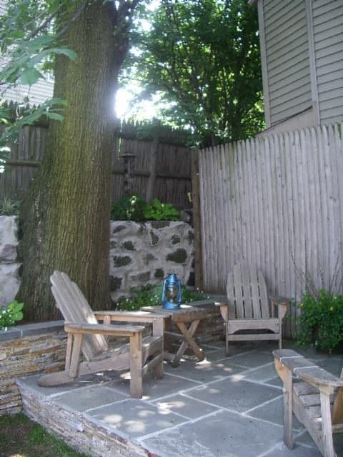 Bluestone patio and sitting wall, overlooked by the kitchen