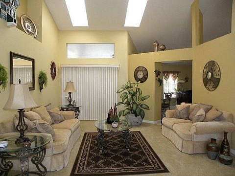 Living room with sliding doors to pool and patio