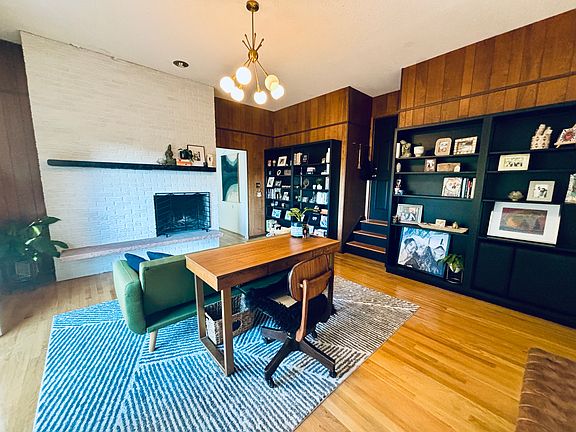 Office with fireplace and deck