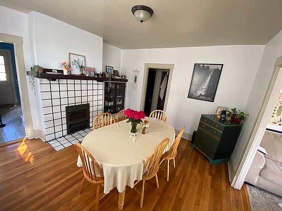 Hardwood floor, original fireplace dining room