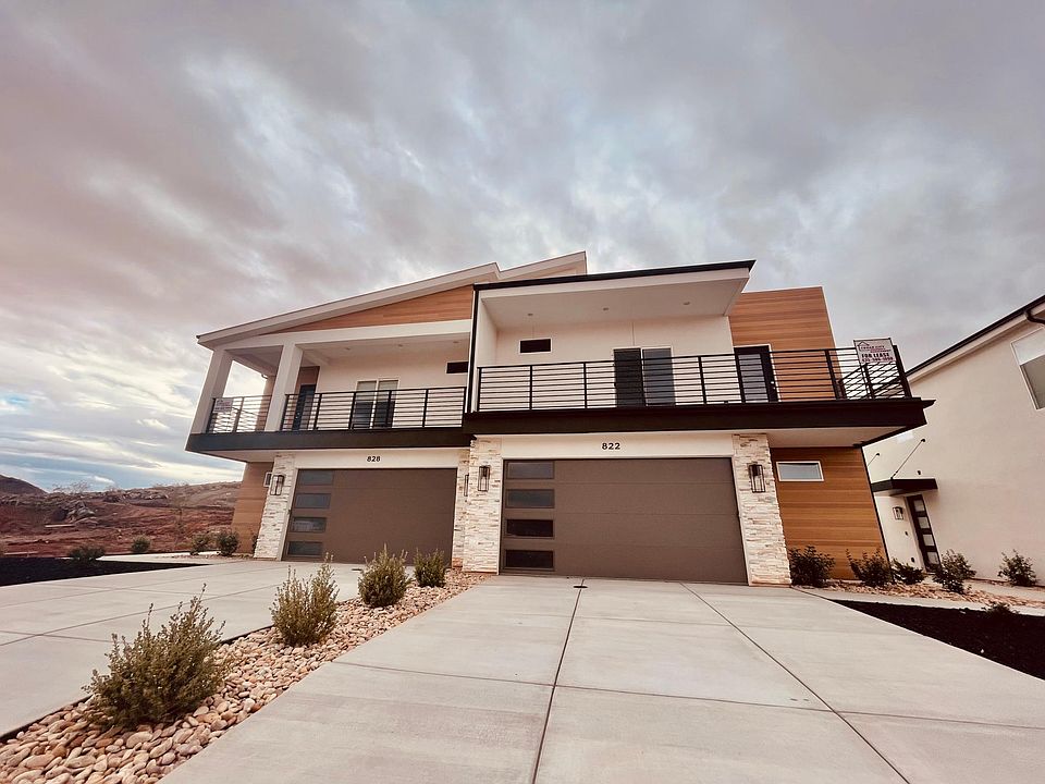 Front exterior of townhomes. Long driveways. BOTH units for rent!