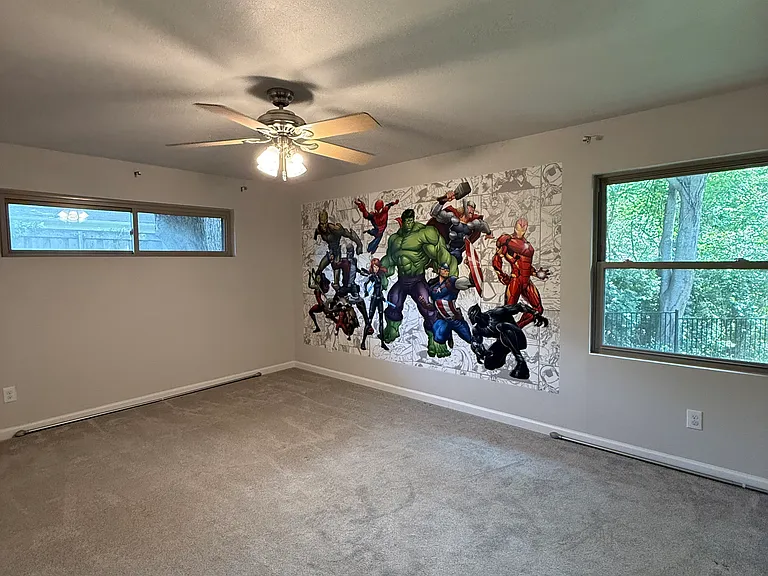 Large Bedroom 1. Marvel mural can be removed if requested.