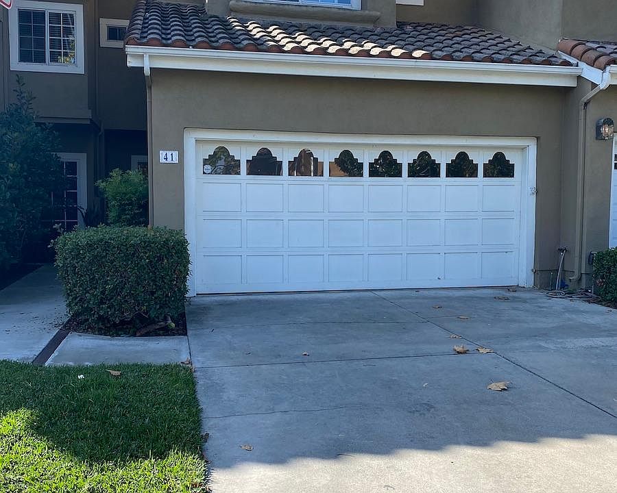 Two car attached garage with two spots in the driveway
