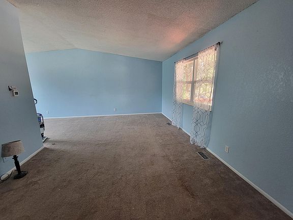 living room, by front door and entry-way
