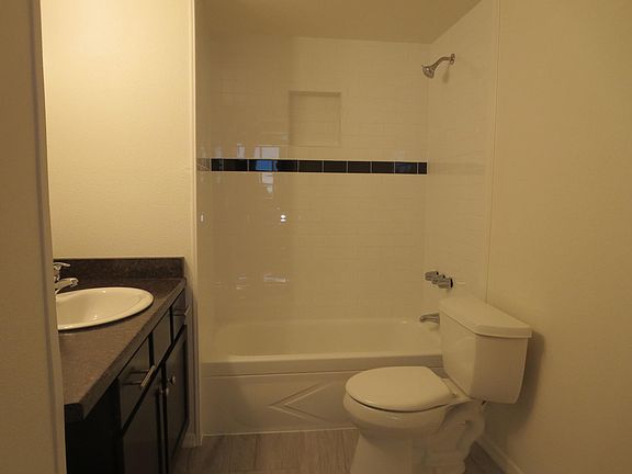 Tile bath with laundry unit