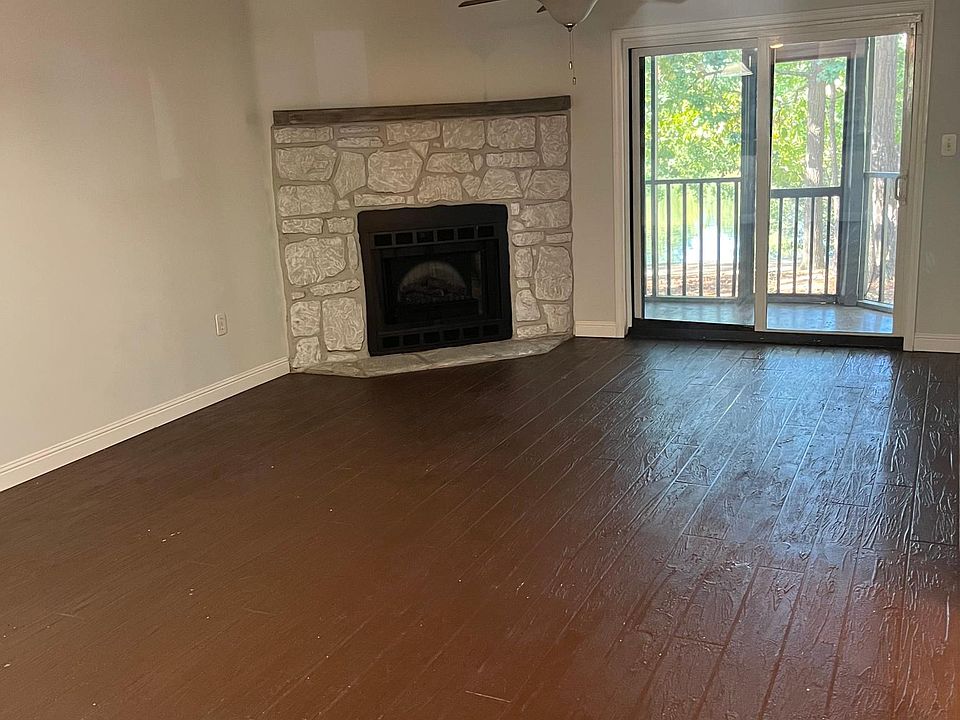 textured stained concrete flooring in the living room and kitchen gives a modern look while also allowing for easy cleaning