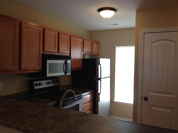 Kitchen - view over counter (pantry door on right)