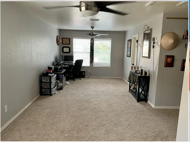 Loft with ceiling fans installed
