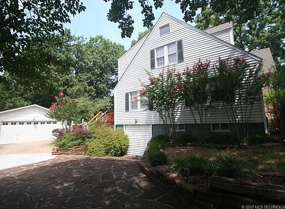 Showcase Bartlesville Bungalow w/ 2 car garage and finished basement.