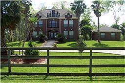 Fenced in 3 Story Home on a Hill with Two Gates