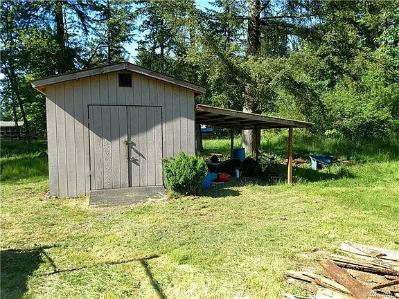 A good sized storage shed and lean too for your riding mower...under the carport is an actual root cellar.