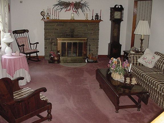 Living room with wood burning fireplace